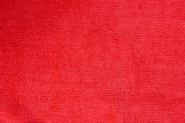 Red kitchen towel isolated on a white background.Folded towel.Kitchen ware. Kitchen utensils.