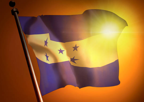 istock winner waving Honduras flag against the sunset 675379618