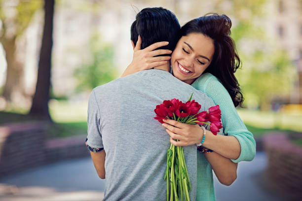 istock Happy, young couple is hugging in the park 675382546