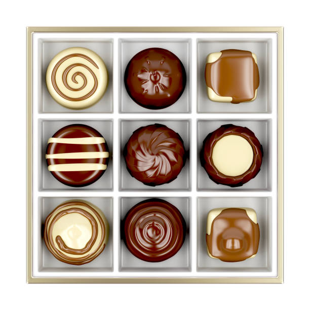 Box with chocolate candies Top view of box with chocolate candies, isolated on white background chocolate pieces stock pictures, royalty-free photos & images