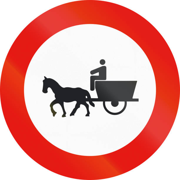 istock Road sign used in Spain - Forbidden entry to animal-drawn vehicles 675386722