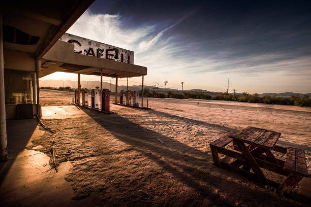 Abandoned Cafe in the Desert An abandoned cafe/gas station sits in the California desert. ghost town stock pictures, royalty-free photos & images
