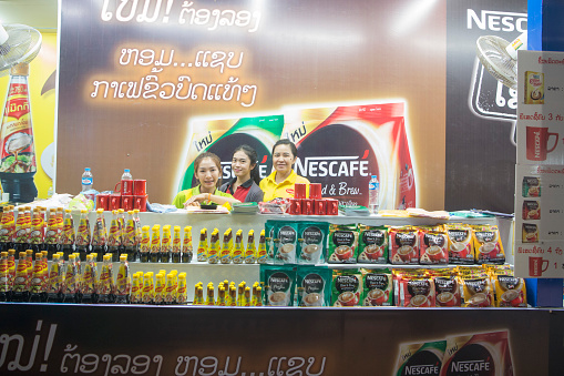 a nestle and nescafe shop at the market at the Pha That Luang Festival in the city of vientiane in Laos in the southeastasia.