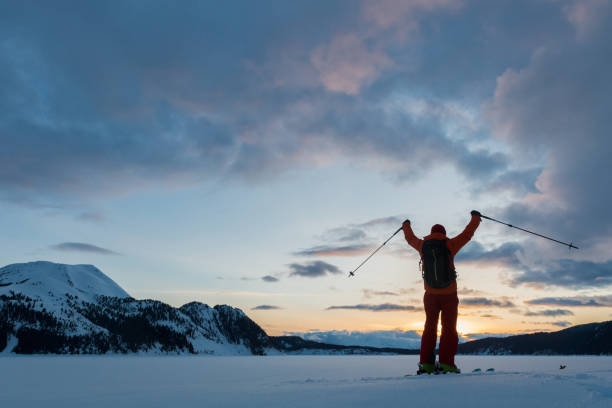 istock Skier with a stunning mountain sunset 675403466