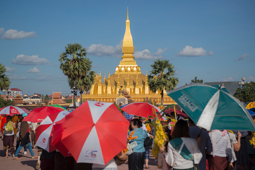 People at a ceremony at the Pha That Luang Festival in the city of vientiane in Laos in the southeastasia.