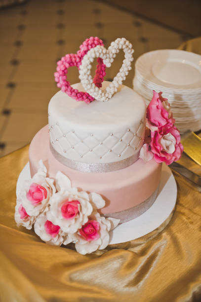 istock Cake with pink flowers and hearts 6759. 675412480