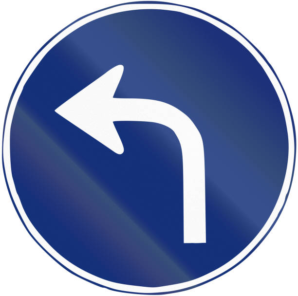 istock Road sign used in Spain - Left turn ahead 675412796