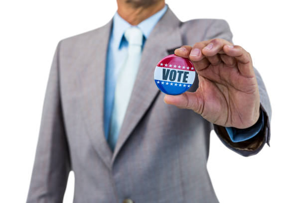 Businessman holding a badge on white background