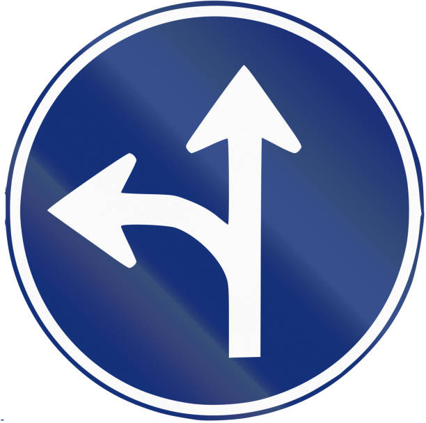 istock Road sign used in Spain - turn left or straight 675423676