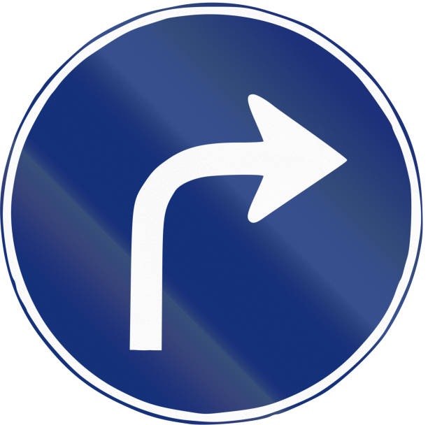 istock Road sign used in Spain - Right turn ahead 675427040