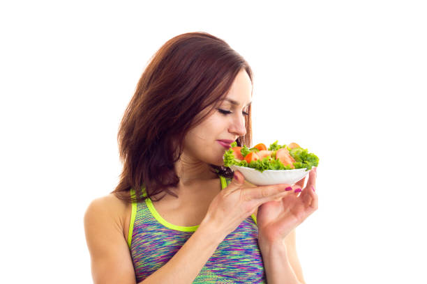 istock Sportive woman holding salad 675433194