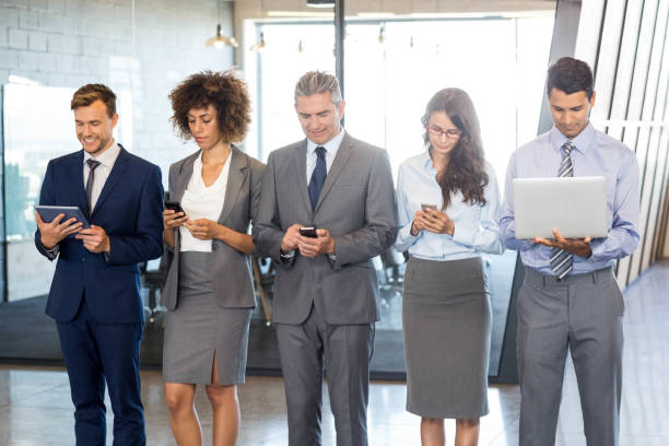 istock Businesspeople using mobile phone, lap top and digital tablet 675433294