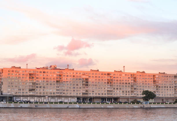 Embankment of Neva river on the outskirts of St. Petersburg at sunset, Russia.