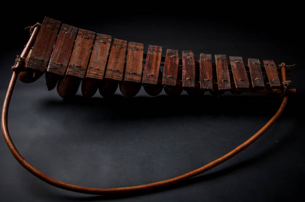 African music instrument, wooden marimba with two bakets, isolated on dark background African music instrument, wooden marimba with two bakets, isolated on dark background marimba stock pictures, royalty-free photos & images