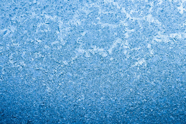 istock blue frosty winter background 675443054