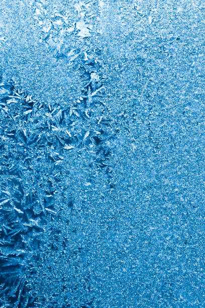 istock blue frosty winter background 675443076