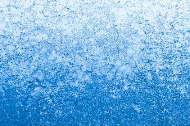 istock blue frosty winter background 675443114