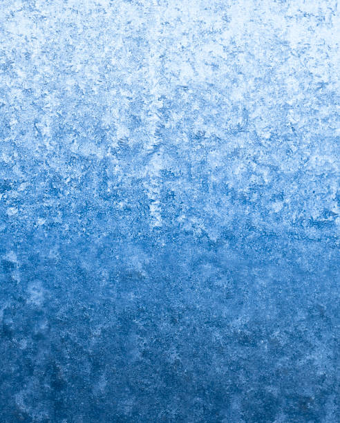 istock blue frosty winter background 675443120
