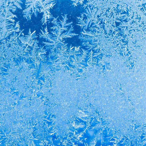 istock blue frosty winter background 675443128