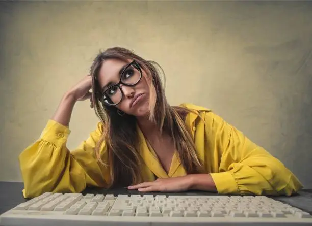 Young woman looks very bored