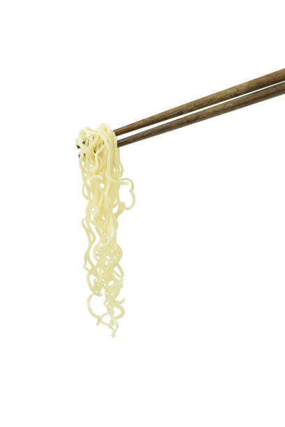 istock chopsticks holding oriental noodles isolated on a white background 675451854