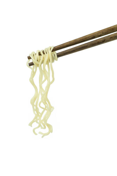 istock chopsticks holding oriental noodles isolated on a white background 675451878
