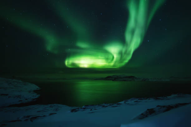 istock Northern lights. Aurora borealis nature landscape at night 675452034
