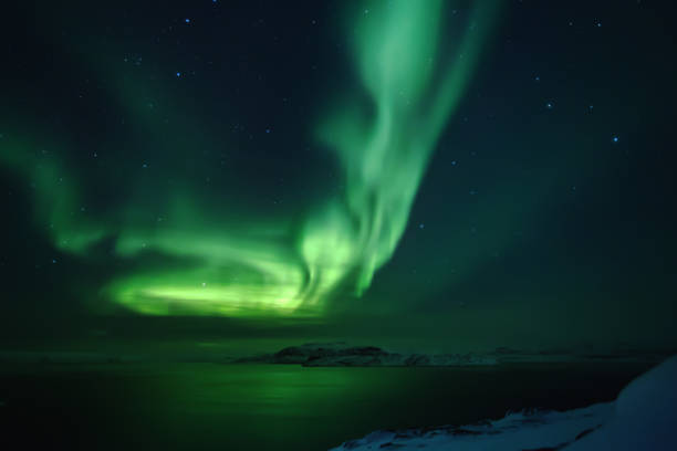 istock Northern lights. Aurora borealis nature landscape at night 675452066