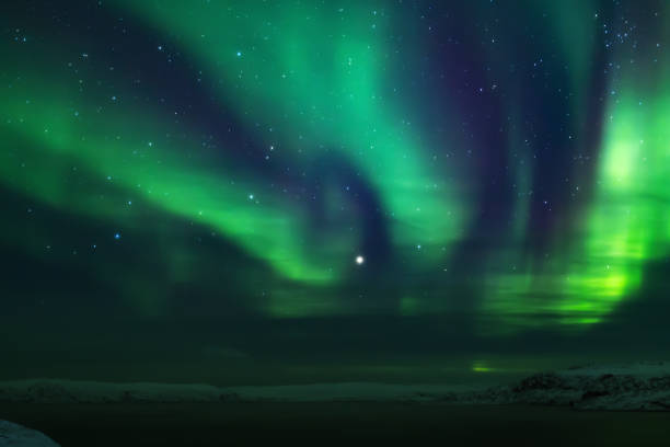istock Northern lights. Aurora borealis nature landscape at night 675452088