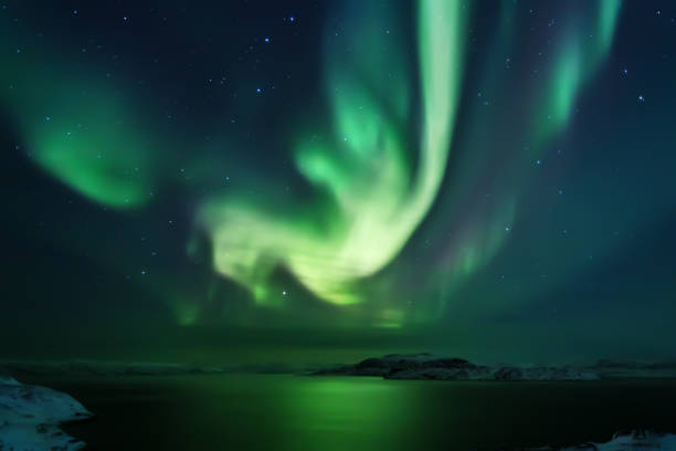 istock Northern lights. Aurora borealis nature landscape at night 675452128