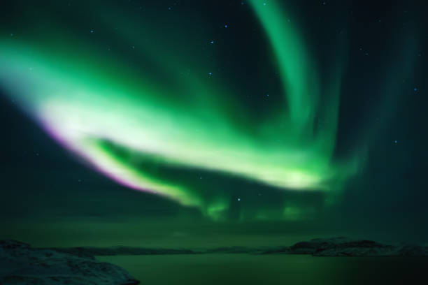 istock Northern lights. Aurora borealis nature landscape at night 675452134
