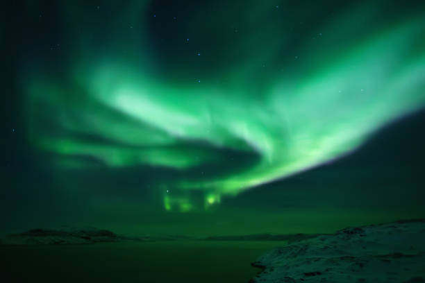 istock Northern lights. Aurora borealis nature landscape at night 675452140
