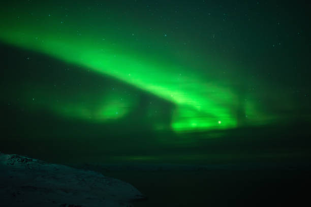 istock Northern lights. Aurora borealis nature landscape at night 675452290