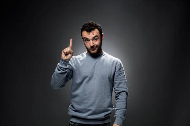 istock Young Man Showing Number One with Index Finger 675455124