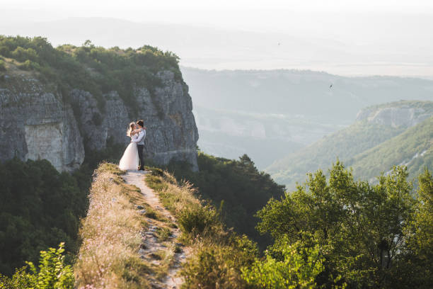 istock Wedding photo shoot in the mountains with stunning views 675458496