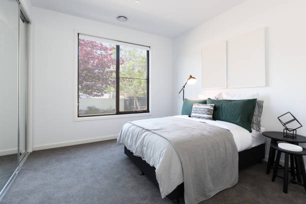 Designer styled bedroom with garden outlook stock photo