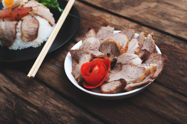 Chinese food, Fried pork with rice and agg on wooden