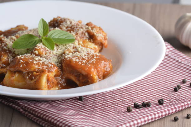 Rondelli with tomato sauce Rondelli with tomato sauce comida italiana stock pictures, royalty-free photos & images