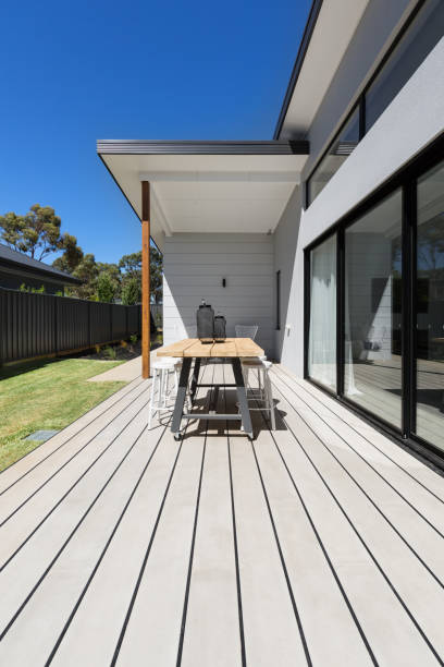 istock Large outdoor decking and high entertaining  table in a new home 675473156