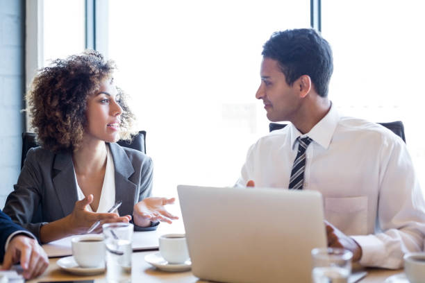 istock Businesspeople having a discussion in conference room 675479146
