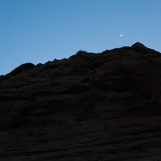 istock Silhouette of rock with moon 675485030