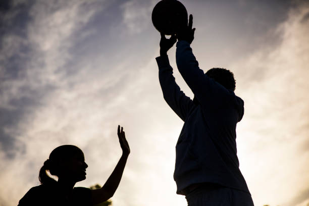 istock Father and Daughter Playing Basketball 675485360