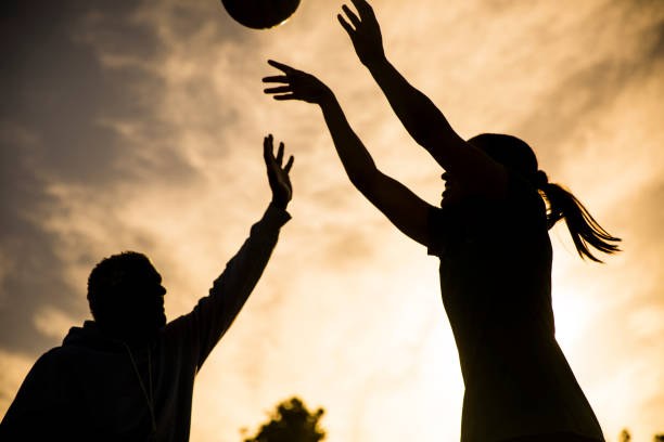 istock Father and Daughter Playing Basketball 675485388