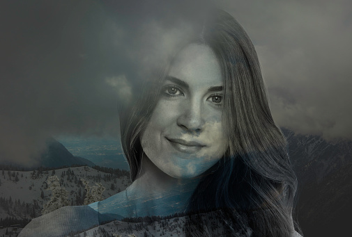 Double Exposure of woman and mountains
