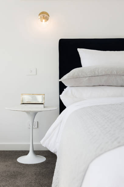 istock Luxe styled bedroom with gold wall sconce lighting 675492280