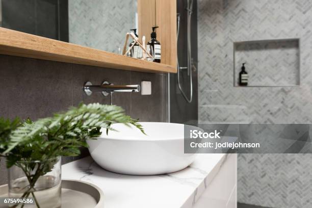 Bathroom Details Clean White Basin With Shower Tiling Behind Stock Photo - Download Image Now