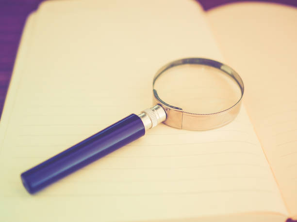 istock Education Concepts: Book and magnifying glass 675498350