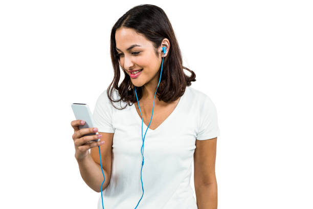 istock Happy woman listening music while using mobile phone 675511848