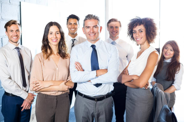 istock Businesspeople standing with arms crossed 675514950