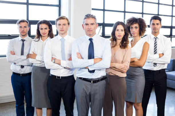 istock Businesspeople standing with arms crossed 675515540